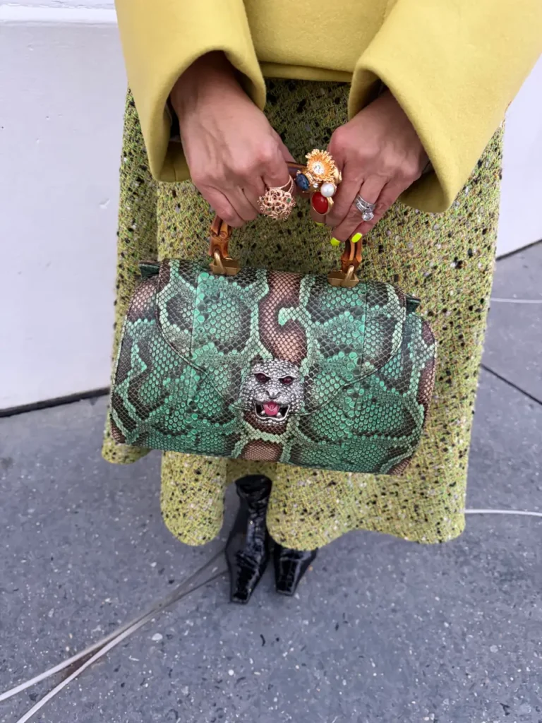 Sydney Stinson with holding a handbag